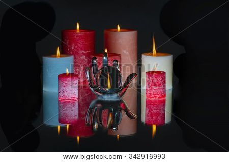 Crystal Hand Holding A Crystal Ball With Candles