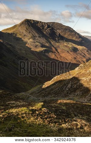Majestic Autumn Fall Landscape Image Of Mountain Peaks In Lake District Near Buttermere With Gorgeou