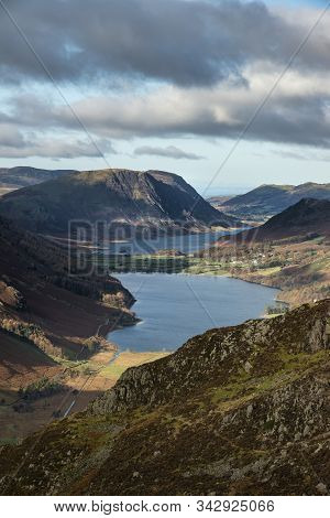 Epic Autumn Fall Landscape Of Buttermere And Crummock Water Surrounded By Mountain Peaks In Lake Dis