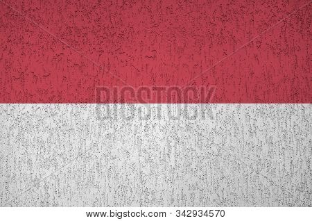 Indonesia Flag Depicted In Bright Paint Colors On Old Relief Plastering Wall. Textured Banner On Rou