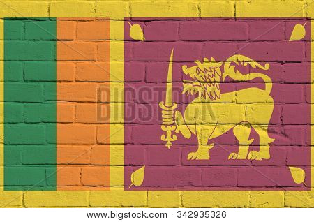 Sri Lanka Flag Depicted In Paint Colors On Old Brick Wall. Textured Banner On Big Brick Wall Masonry