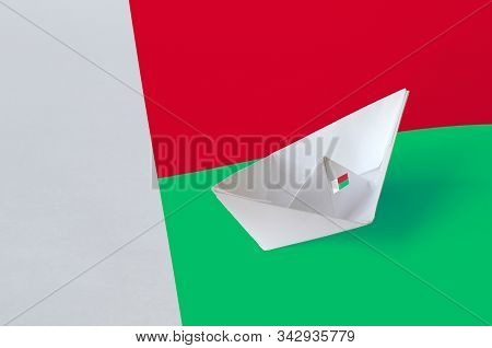 Madagascar Flag Depicted On Paper Origami Ship Closeup. Handmade Arts Concept