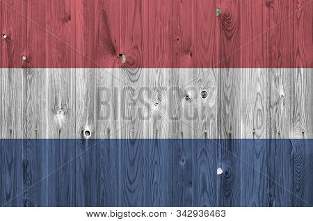 Netherlands Flag Depicted In Bright Paint Colors On Old Wooden Wall. Textured Banner On Rough Backgr