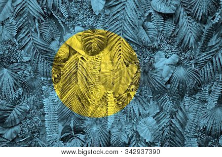 Palau Flag Depicted On Many Leafs Of Monstera Palm Trees. Trendy Fashionable Backdrop