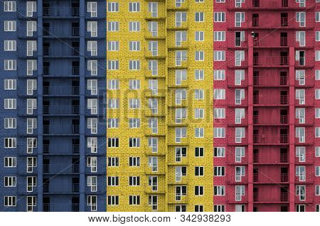 Chad Flag Depicted In Paint Colors On Multi-storey Residental Building Under Construction. Textured 