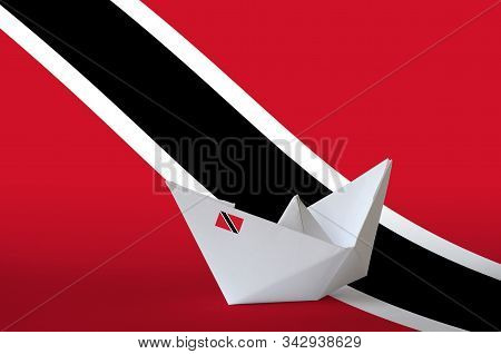 Trinidad And Tobago Flag Depicted On Paper Origami Ship Closeup. Handmade Arts Concept
