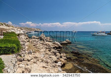 Scenic View On The Bay With Turquoise Water And The Beach Of Kalithea Springs At Greek Island Rhodes
