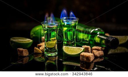 Absinthe Or Mint Liquor Shot. Green Bitter Wormwood Tincture In Glasses. Absinthe Shots With Sugar C