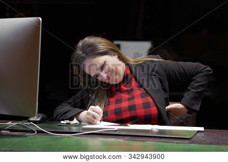 Office Manager Woman With Pain In Kidneys In The Workplace. Girl With Backache Clasping Her Hand To 