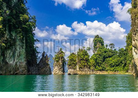 View Of Beautiful Rock Formation On A Bright Sunny Day At Ratchaprapa Dam, Or Locally Known As Cheow