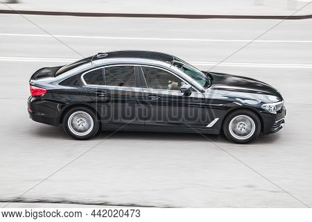 Bmw 530i G30 Is Seventh Generation Of The Bmw 5 Series. Side View Of Moving Black Car On The Street.
