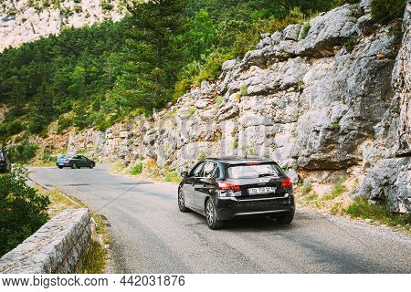 Verdon, France - June 29, 2015: Black Colour Peugeot 308 5-door Car On Background Of French Mountain