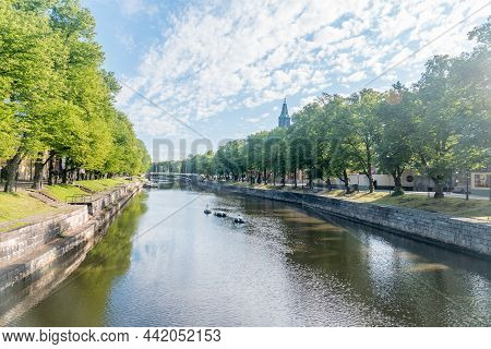 Turku, Finland - August 6, 2021: Summer View On Aurajoki River With Turku Cathedral In The Backgroun