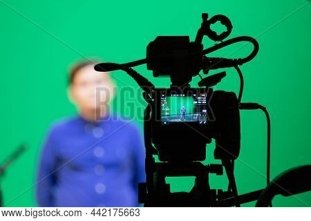 Saratov, Russia - September 4, 2018: Videography Of A Boy In A Blue Shirt In The Studio On A Green B