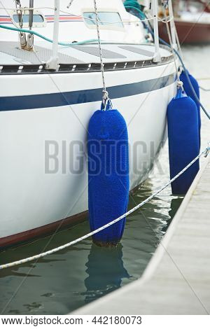 Fenders Suspended Between A Boat And Dockside For Protection. Maritime Fenders