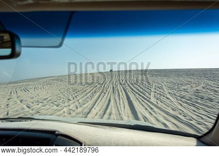View Out Of A Car Windshield On A Dune Driving Tour In Khor Al Adaid Desert In Qatar.