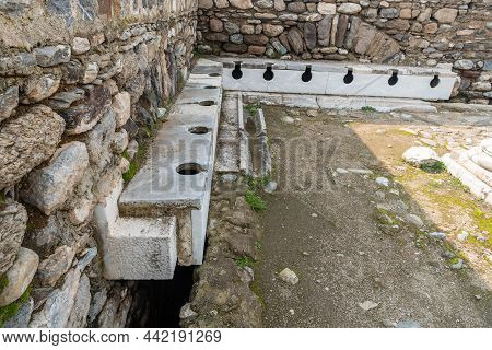 Sitting Place Of The Latrina (public Toilet) In Tralleis (tralles) Ancient City In Aydin, Turkey.