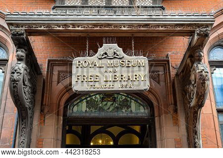 Canterbury, Kent, England - Oct 23 2021: Wooden Hanging Sign At The Entrance To Canterbury Royal Mus