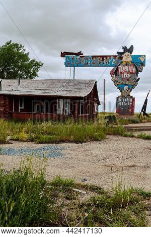 Powder River, Wyoming - June 26, 2021: Abandoned Tumble Inn Lounge, Cafe And Steakhouse Has Been Clo