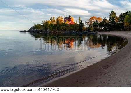 Marquette Harbor Lighthouse At Sunset In The Fall Along Lake Superior