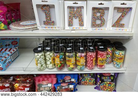 Mackay, Queensland, Australia - December 2021: Jars And Packets Of Lollies For Sale As Well As Freck