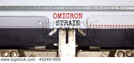 Covid-19 New Omicron Virus Variant Symbol. Concept Words Omicron Strain Typed On Retro Typewriter. M