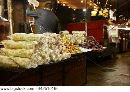 Sale Of Churros. Fair Stall To Sell Typical Spanish Donuts