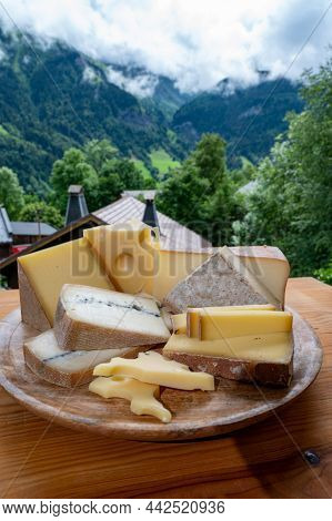 Cheese Collection, Wooden Board With French Cheeses Comte, Beaufort, Abondance, Emmental, Morbier An