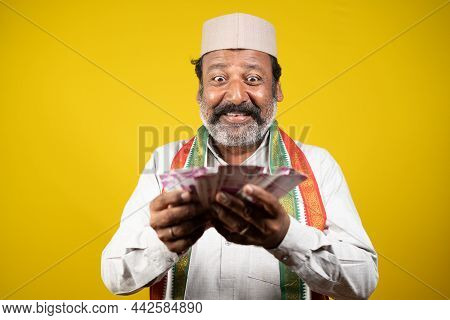 Laughing Corrupt Indian Politician Counting Money - Concept Of Showing Greedy Politics, Bribe And Co