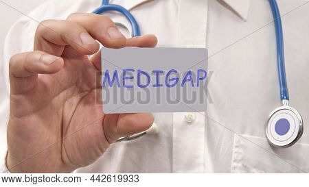 Medigap Written On The Doctor's Card. Medical Concept.