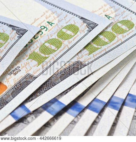 American Banknotes Of One Hundred Dollars. Fragment Of Bills Close-up. New Sample Money. Focus On Th