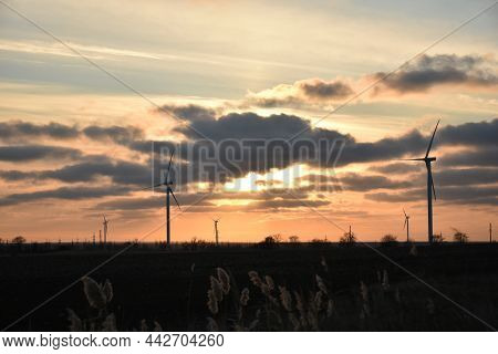 Sunlight Breaks Through The Clouds At Sunset