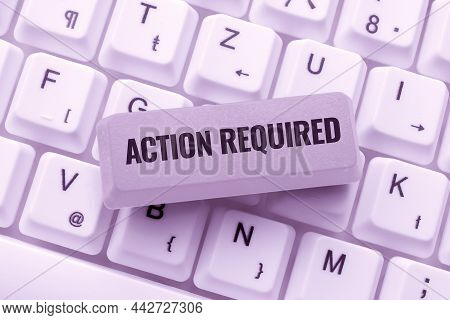 Hand Writing Sign Action Required. Word Written On Regard An Action From Someone By Virtue Of Their 