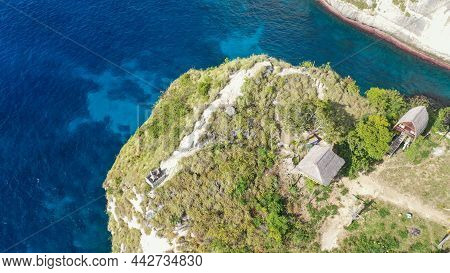 Aerial View Of The Small Island Of Nusa Batumategan From The Atuh Rija Lima Shrine On Nusa Penida Is