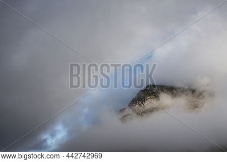 Epic Mountain Landscape Image Of Pen Yr Ole Wen In Snowdonia National Park With Low Cloud On Peak An