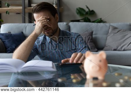 Man Calculates Expenses Feels Concerned Due Money Shortage