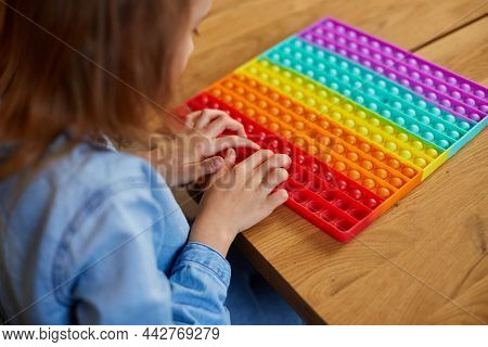 Little Girl Playing With Big Silicone Popit, Simple Dimple, Bubble Fidget Toy