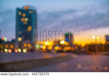 Modern Buildings In A Big City, Tall Houses Tower. Evening Outdoor, Road And Foreground Empty For Co