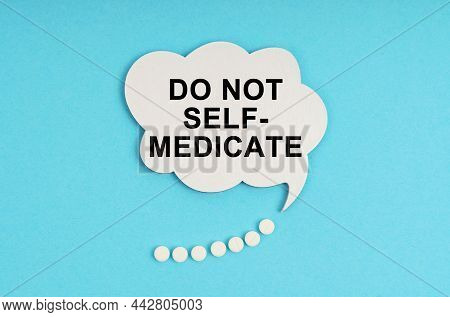 Medicine And Health Concept. On A Blue Table Are Pills And A White Plate With The Inscription - Do N