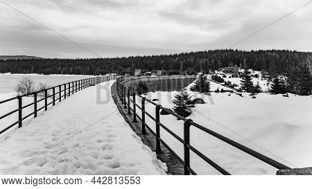 Dam On Cerna Nisa In Winter Time. Jizera Mountains, Czech Republic. Black And White Image.