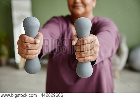 Close Up Of Black Senior Woman Holding Dumbbells And Enjoying Workout At Home, Copy Space