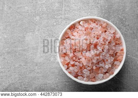 Pink Himalayan Salt In Bowl On Grey Table, Top View. Space For Text