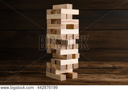 Jenga Tower Made Of Wooden Blocks On Table