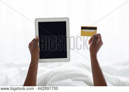 Cropped Of Black Woman Holding Digital Tabllet And Credit Card