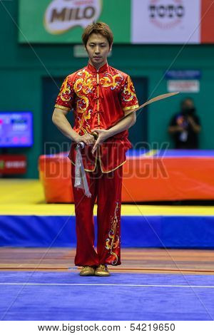 KUALA LUMPUR - NOV 03: South Korea's Jo Kyeyong performs with a sword in the Men's 'Daoshu' Event at the 12th World Wushu Championship on November 03, 2013 in Kuala Lumpur, Malaysia.