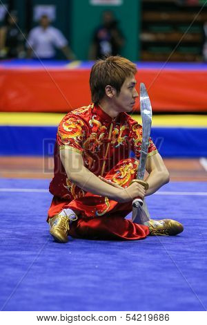 KUALA LUMPUR - NOV 03: South Korea's Jo Kyeyong performs with a sword in the Men's 'Daoshu' Event at the 12th World Wushu Championship on November 03, 2013 in Kuala Lumpur, Malaysia.