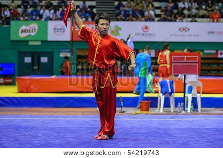 KUALA LUMPUR - NOV 03: Japan's Ryosuke Kishi performs with a sword in the Men's 'Daoshu' Event at the 12th World Wushu Championship on November 03, 2013 in Kuala Lumpur, Malaysia.