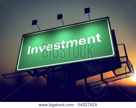 Investment - Billboard on the Sunrise Background.