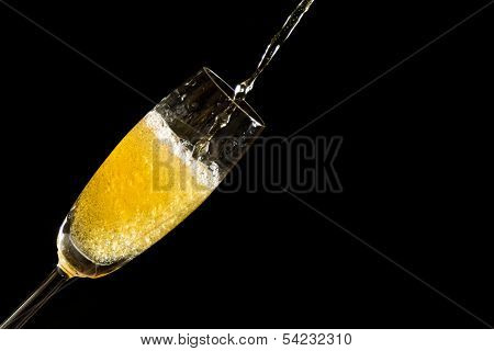 Pouring champagne with foam and bubbles