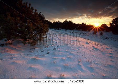 Sunbeams Over Snowy Hills At Sunset